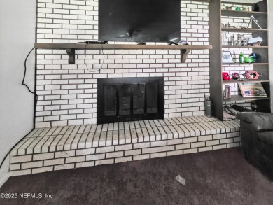 Welcome to this charming 3 bed, 2 bath brick POOL home sitting