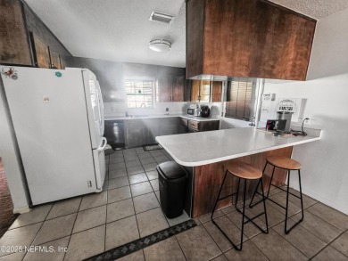 Welcome to this charming 3 bed, 2 bath brick POOL home sitting