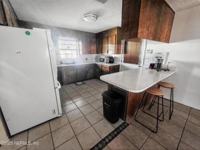 Welcome to this charming 3 bed, 2 bath brick POOL home sitting