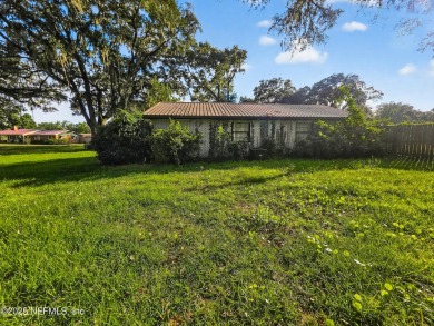 Welcome to this charming 3 bed, 2 bath brick POOL home sitting