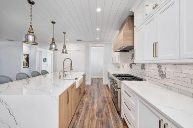 Discover an exquisite home situated on the coveted Sugar Sand