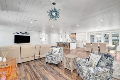 Discover an exquisite home situated on the coveted Sugar Sand