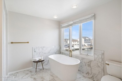 This meticulous waterfront stunner will take your breath away!