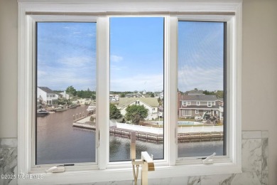 This meticulous waterfront stunner will take your breath away!