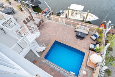 This meticulous waterfront stunner will take your breath away!