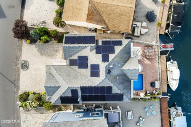 This meticulous waterfront stunner will take your breath away!