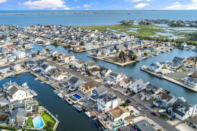 This meticulous waterfront stunner will take your breath away!