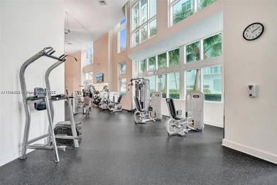 Live the vibrant Edgewater lifestyle in this impeccably