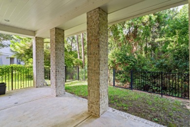 Welcome to refined coastal living in this exquisite end-unit