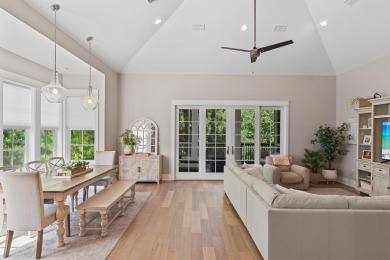 Welcome to refined coastal living in this exquisite end-unit