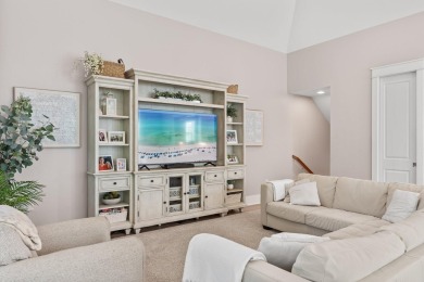 Welcome to refined coastal living in this exquisite end-unit