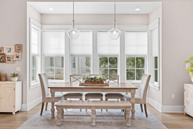 Welcome to refined coastal living in this exquisite end-unit