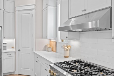 Welcome to refined coastal living in this exquisite end-unit