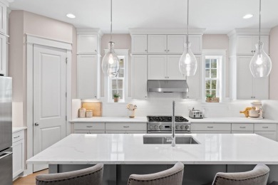 Welcome to refined coastal living in this exquisite end-unit