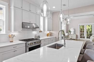 Welcome to refined coastal living in this exquisite end-unit