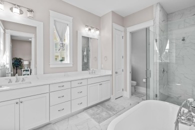 Welcome to refined coastal living in this exquisite end-unit