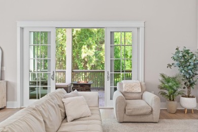 Welcome to refined coastal living in this exquisite end-unit