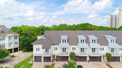 Welcome to refined coastal living in this exquisite end-unit