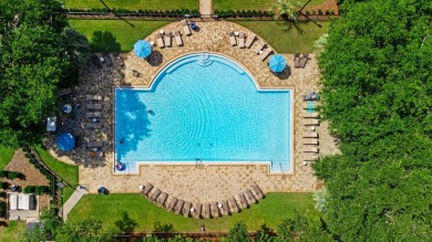 Welcome to refined coastal living in this exquisite end-unit