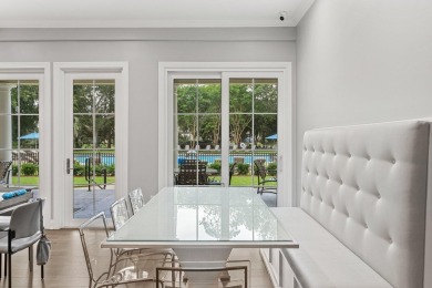 Welcome to refined coastal living in this exquisite end-unit