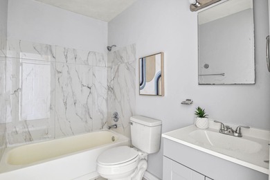 Move in ready, fully updated 1BR/1BA end unit with soaring