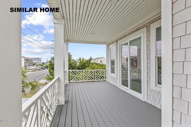 Discover unparalleled coastal living at 607a S Topsail Drive
