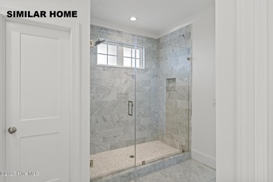 Discover unparalleled coastal living at 607a S Topsail Drive