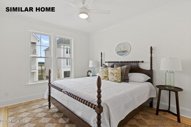 Discover unparalleled coastal living at 607a S Topsail Drive