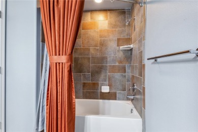 Experience riverfront living at its finest in this spacious