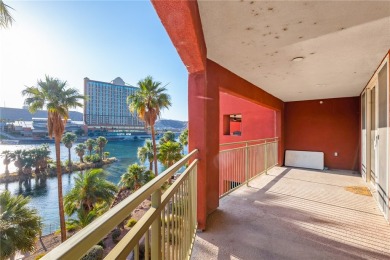 Experience riverfront living at its finest in this spacious