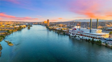 Experience riverfront living at its finest in this spacious