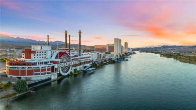 Experience riverfront living at its finest in this spacious