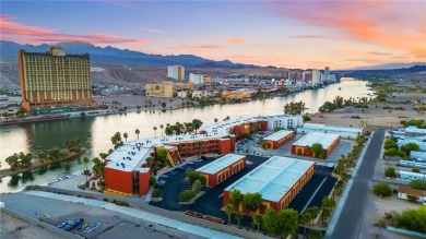 Experience riverfront living at its finest in this spacious