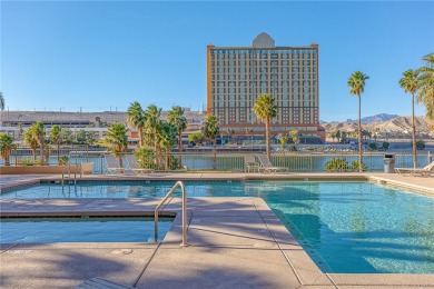 Experience riverfront living at its finest in this spacious