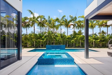 1955 Thatch Palm in Royal Palm Yacht & Country Club is a