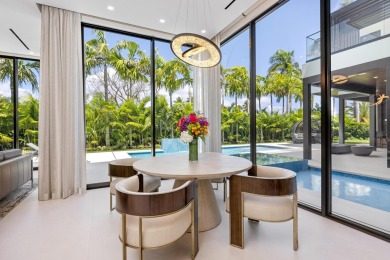 1955 Thatch Palm in Royal Palm Yacht & Country Club is a