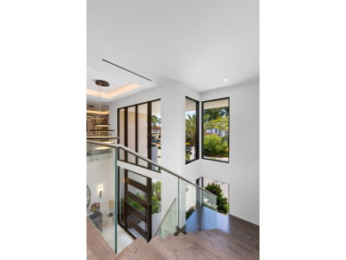 1955 Thatch Palm in Royal Palm Yacht & Country Club is a