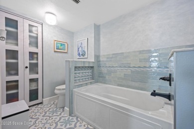 Step into this COMPLETELY RENOVATED riverfront condo & enjoy