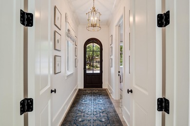 Prepare to be mesmerized by this stunning riverfront masterpiece