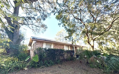 Beautifully refreshed brick home on 1 full acre just off US Hwy