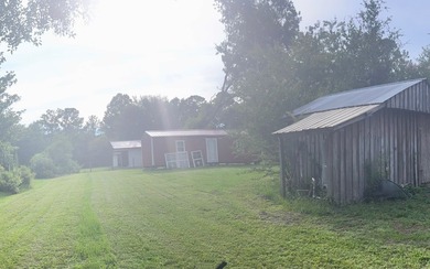 Beautifully refreshed brick home on 1 full acre just off US Hwy