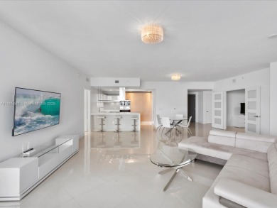 Discover waterfront luxury in this spacious 2-bedroom + den