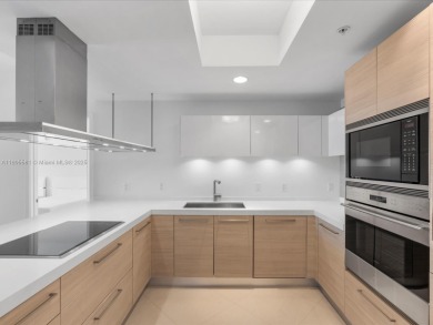 Discover waterfront luxury in this spacious 2-bedroom + den