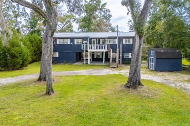 Suwannee Riverfront Living at Its Best! This beautifully updated