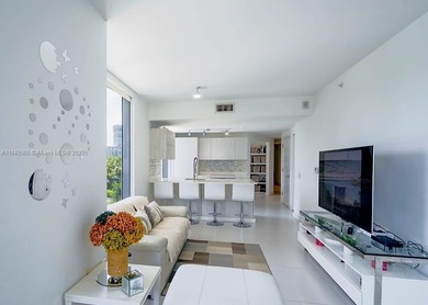 Beautiful 2 bedroom, 2 bath corner apartment with a den that can