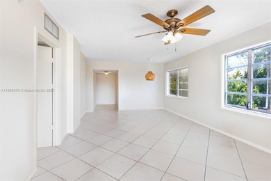 Bright and spacious corner unit with 1 bed, 1.5 baths, and a