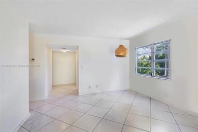 Bright and spacious corner unit with 1 bed, 1.5 baths, and a
