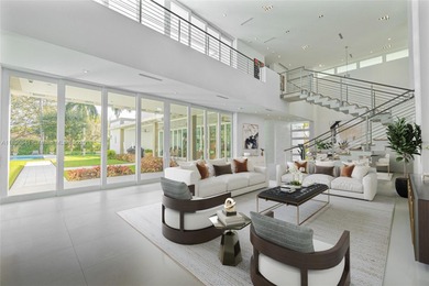 Nestled on nearly an acre in Northeast Pinecrest, this