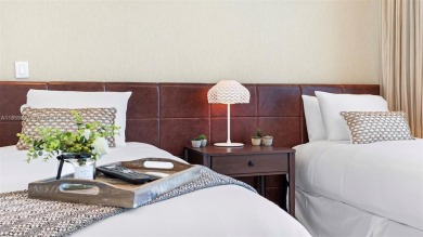 Perched on the 39th floor of The Setai, this stunning 3 bed / 3