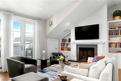 Penthouse chic welcomes you in this elegant, sparkling top floor